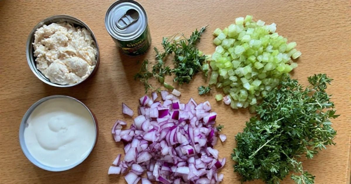 Essential ingredients for a perfect canned chicken salad recipe, featuring canned chicken and fresh vegetables.