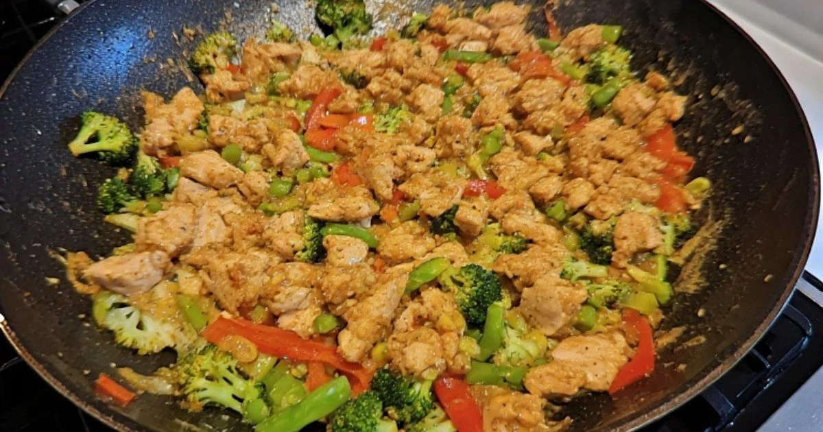 Simple and quick chicken meals like a colorful chicken stir-fry being cooked in a skillet.