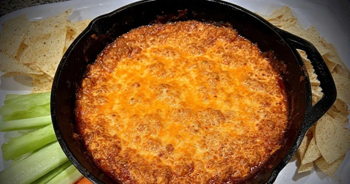 Delicious easy buffalo chicken dip with canned chicken, served warm with chips and vegetables.