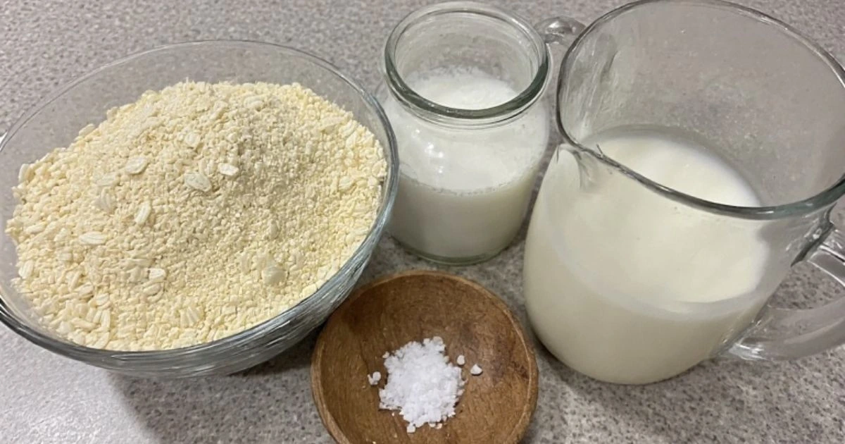 Simple essential ingredients for an authentic cornbread hoe cake recipe, featuring stone-ground cornmeal.